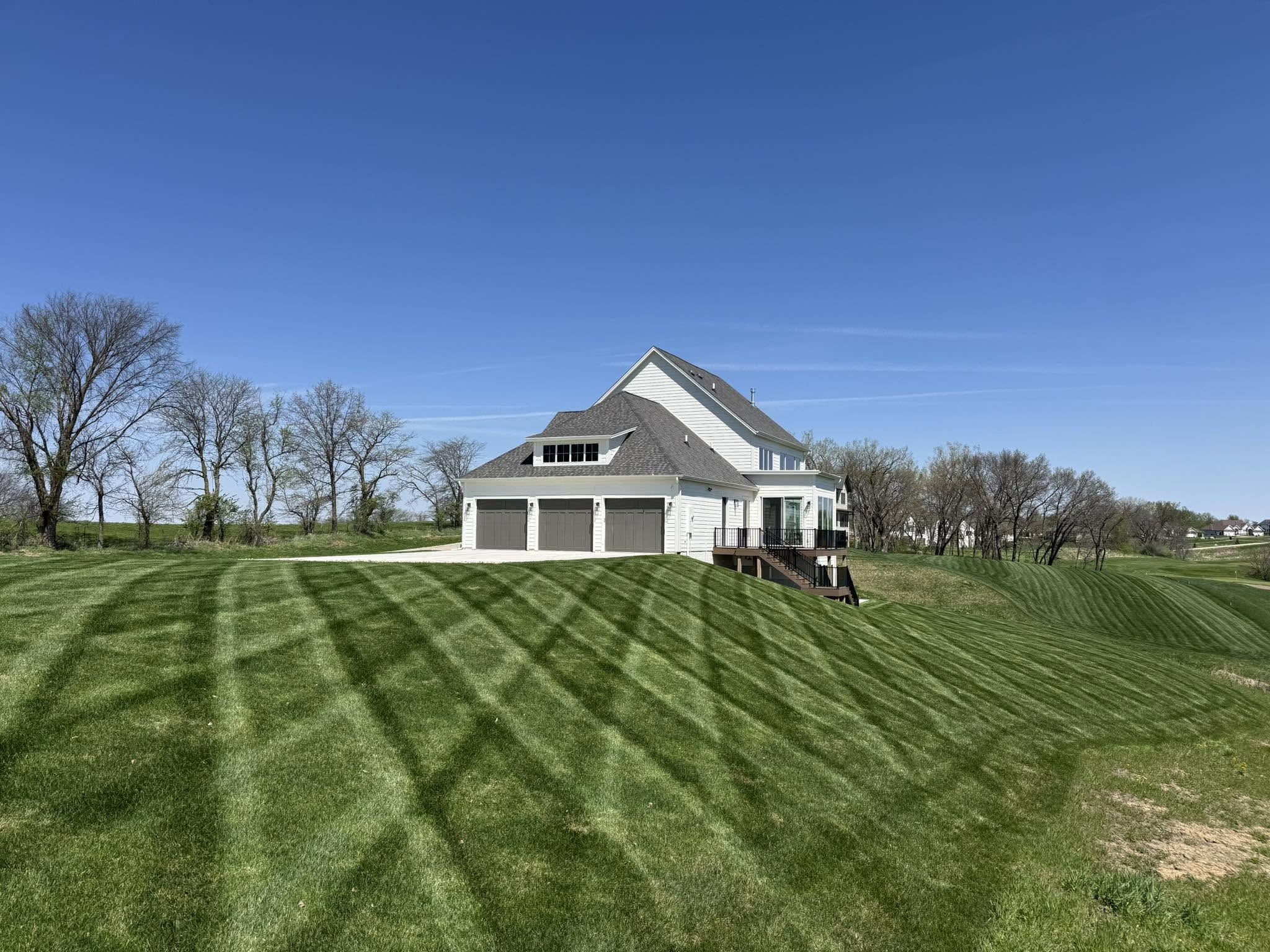Striped lawn by a home